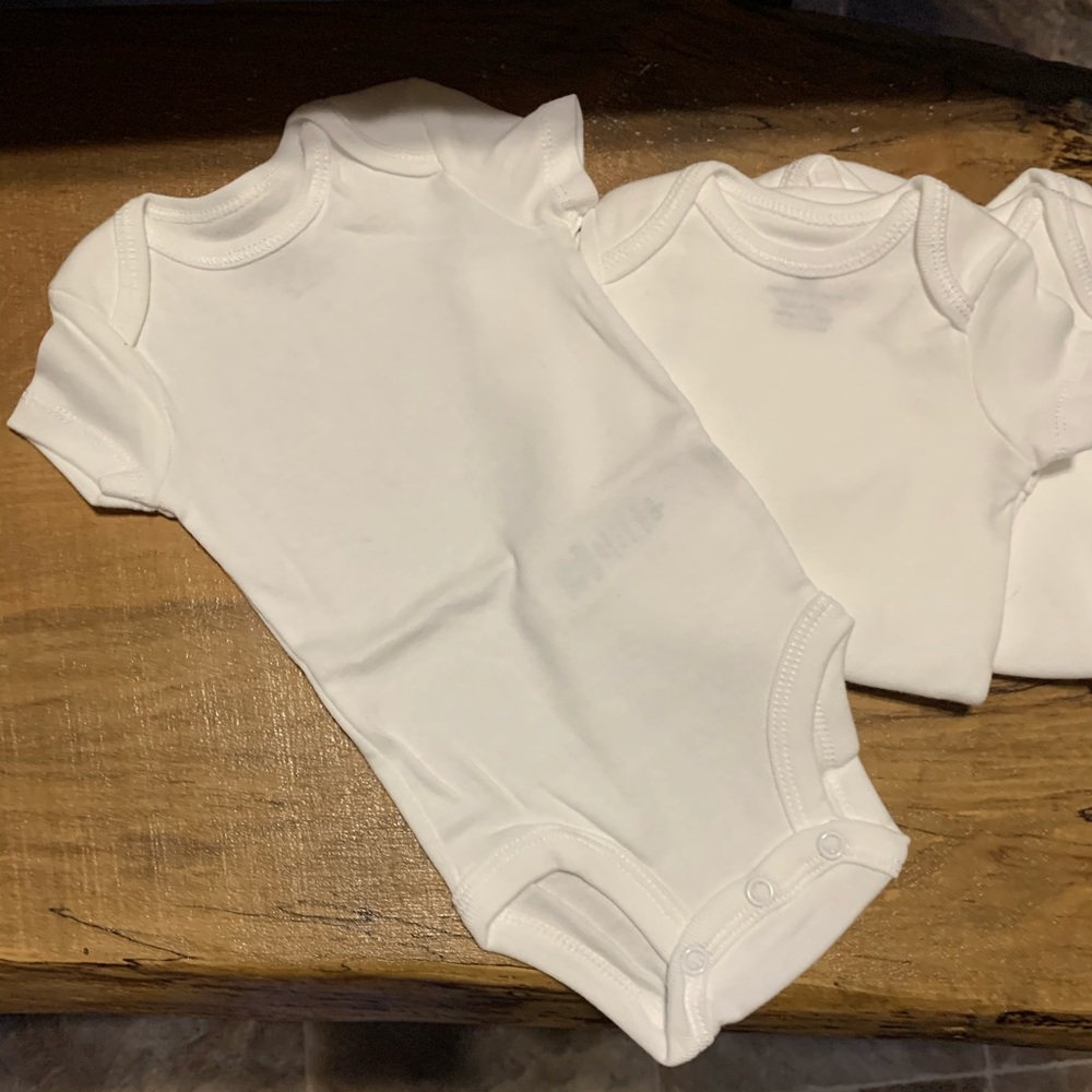 Lot of 4 white NB onsies